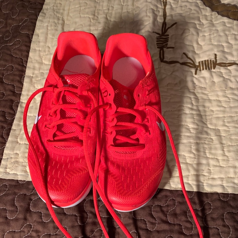 Youth Nike red running shoes size 4.